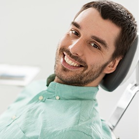 Smiling man in dental chair