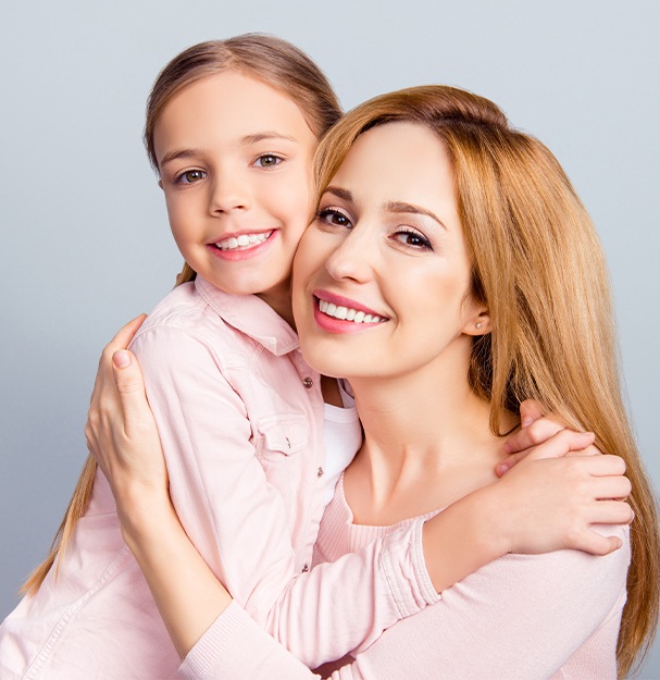 Smiling mother and daughter