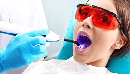 Young woman receiving dental sealants