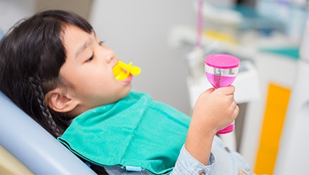 Child receiving fluoride treatment