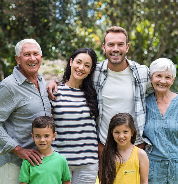 Three generations of family smiling together