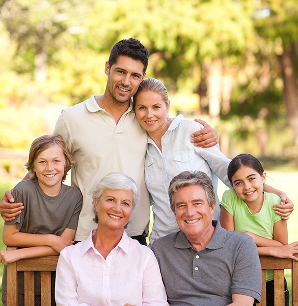 Three generations of family smiling together